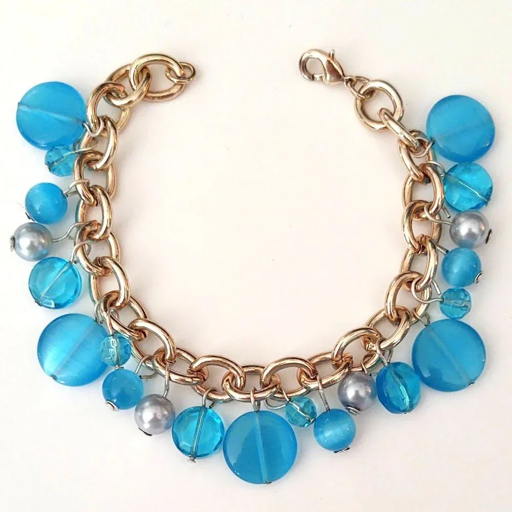 Blue bead and faux pearl charm style bracelet